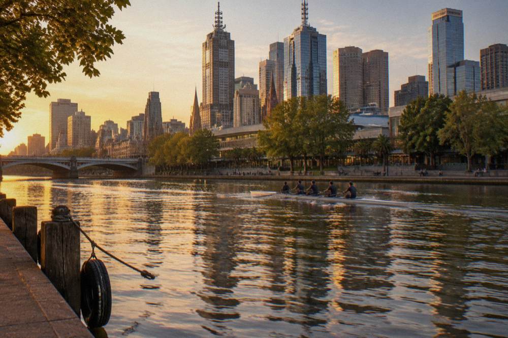 The Yarra River promenade at Southbank with the city skyline reflected in the water at golden hour
