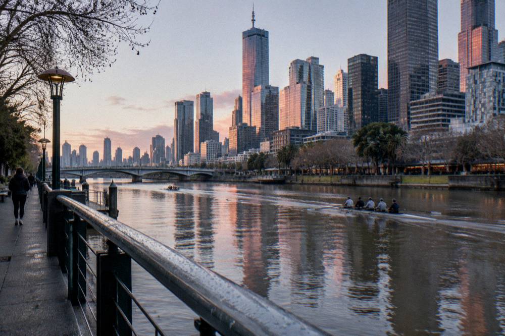 The Yarra River and Southbank promenade with the city skyline behind at dusk